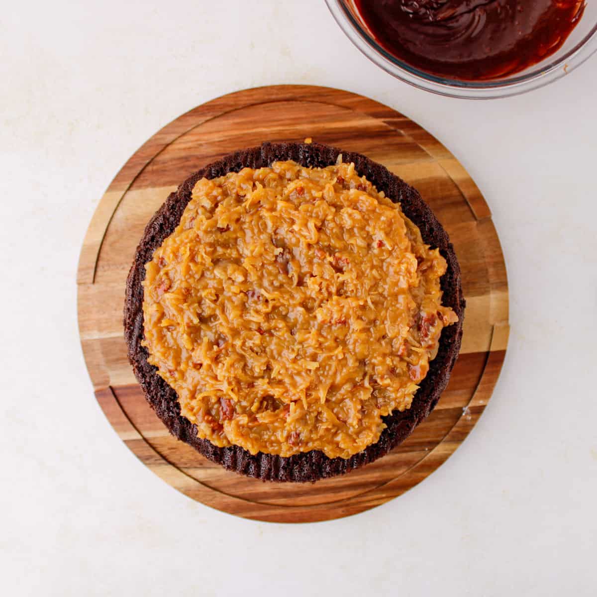 German chocolate cake with coconut pecan filling on top layer