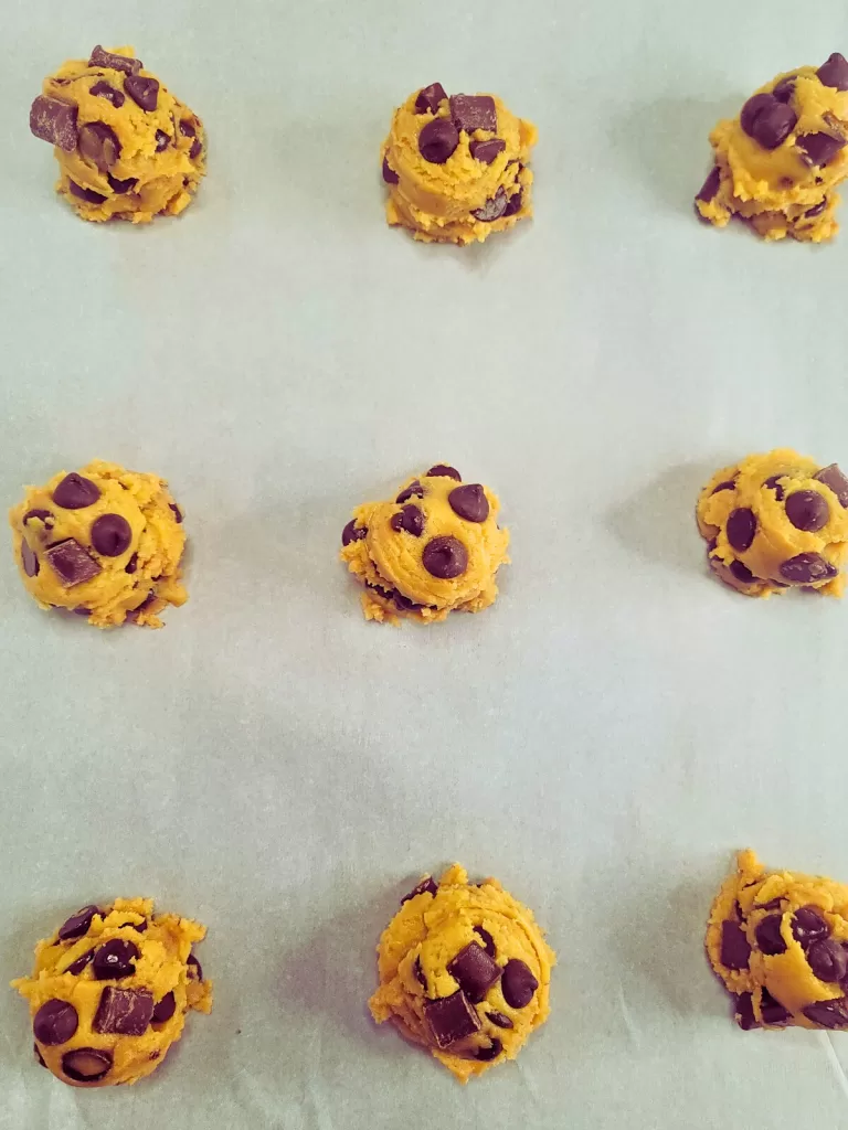 Bakery Style Chocolate Chip Cookies.  Picture of cookie dough on baking sheet.