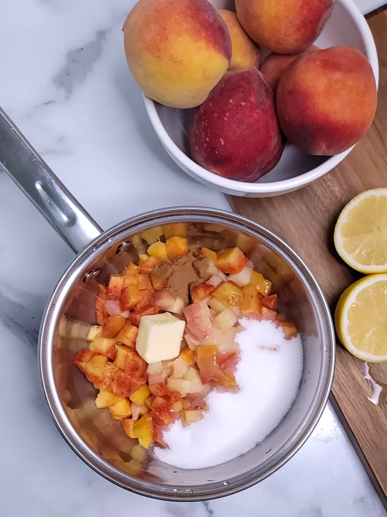 Peach Hand Pies filling being cooked in saucepan.