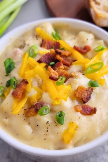 Loaded Potato Soup with green onions, and cheddar cheese