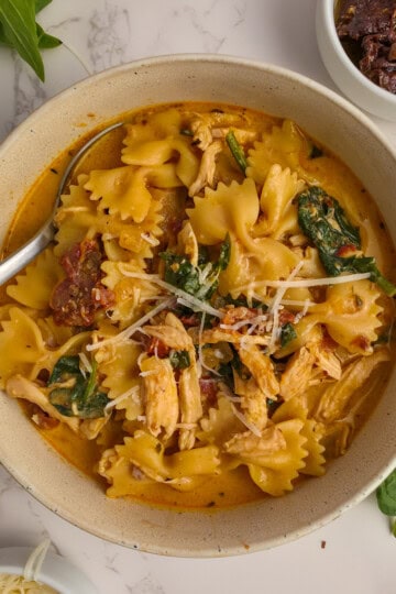 Marry Me Chicken Soup with sundried tomatoes, parmesan cheese and spinach.