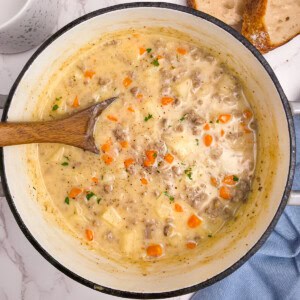 Creamy Potato and Hamburger Soup with cheese and carrots.