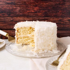 Coconut Cake with Coconut Frosting on cake plate.