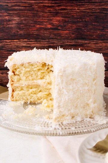 Coconut Cake with Coconut Frosting on cake plate.
